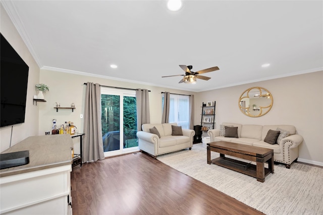 living area with ornamental molding, recessed lighting, ceiling fan, and wood finished floors