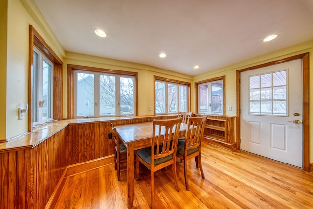 dining room with light wood finished floors and recessed lighting