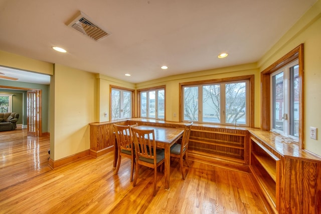 dining area with light wood-style floors, baseboards, visible vents, and recessed lighting