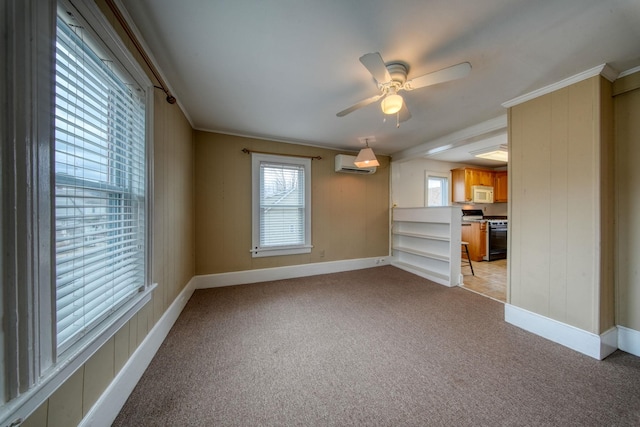 unfurnished living room featuring crown molding, light colored carpet, a wall mounted air conditioner, and plenty of natural light