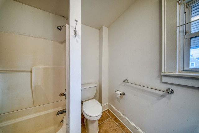 full bath featuring baseboards, toilet, and tile patterned floors