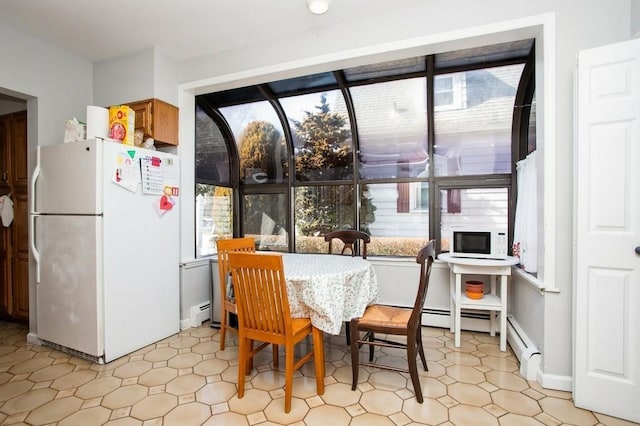 dining area with baseboard heating