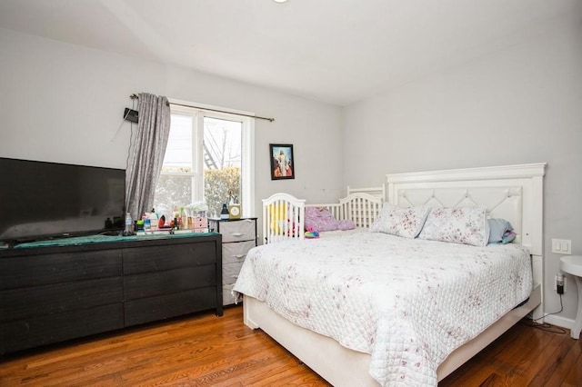 bedroom with wood finished floors