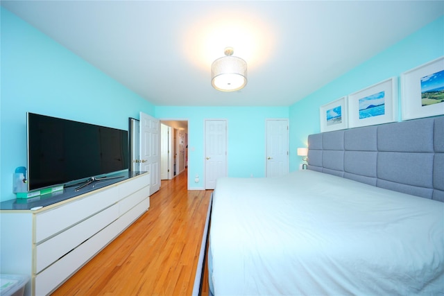 unfurnished bedroom with light wood-style floors