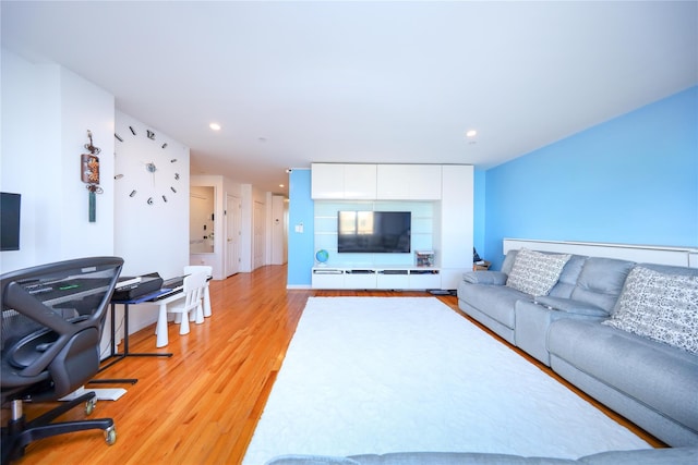 living room featuring recessed lighting and light wood-style flooring