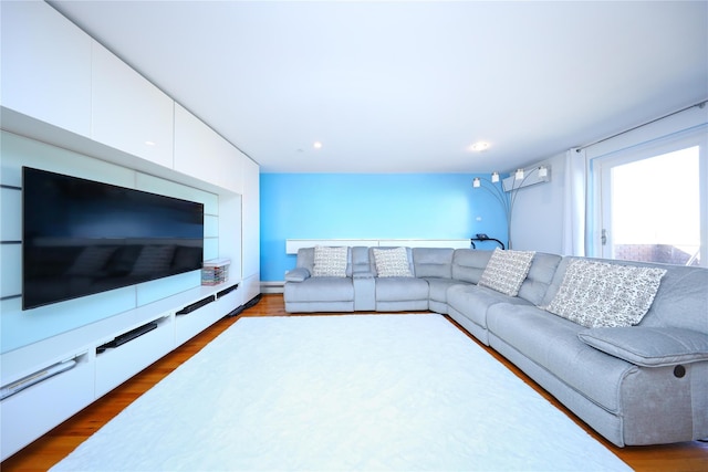 living area featuring dark wood-style floors and recessed lighting