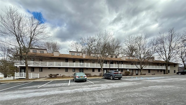 view of property with uncovered parking