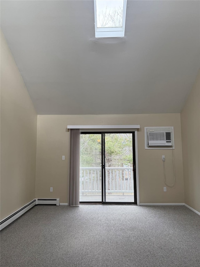 carpeted spare room with baseboards, vaulted ceiling, and a wall unit AC