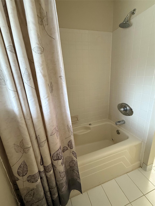 bathroom with tile patterned floors and shower / bathtub combination with curtain