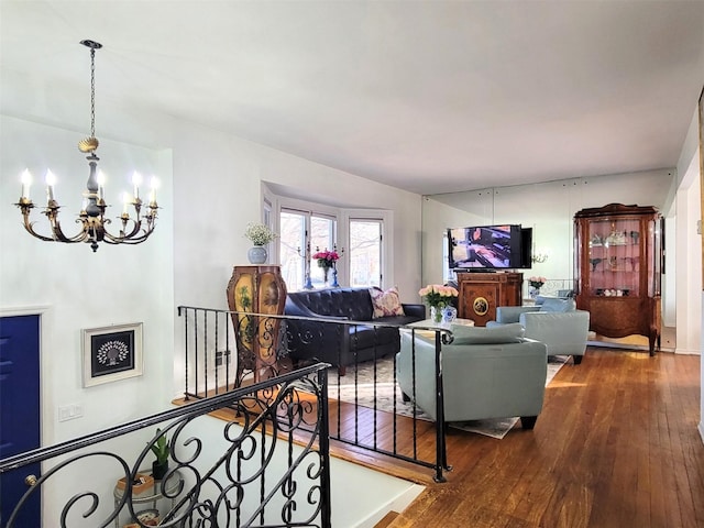 living room featuring hardwood / wood-style flooring and a chandelier