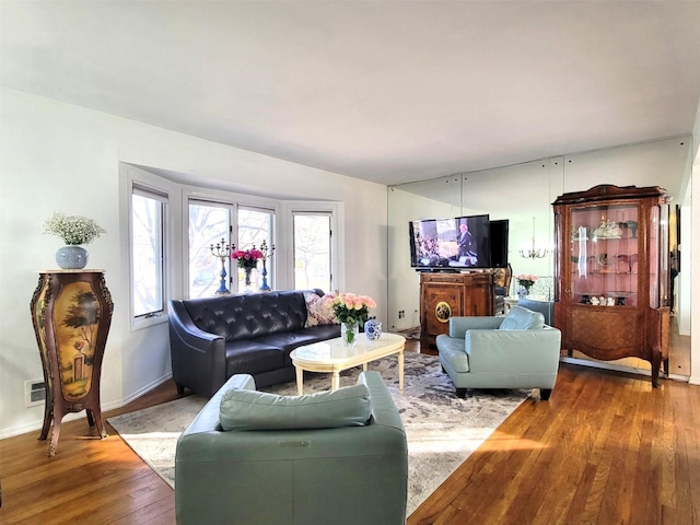 living room with baseboards and hardwood / wood-style floors