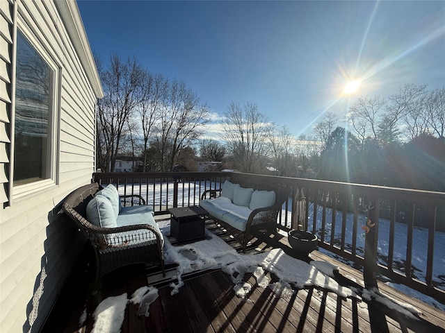 wooden terrace with an outdoor hangout area