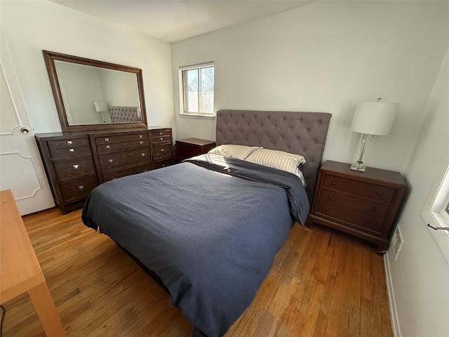 bedroom with light wood-style floors