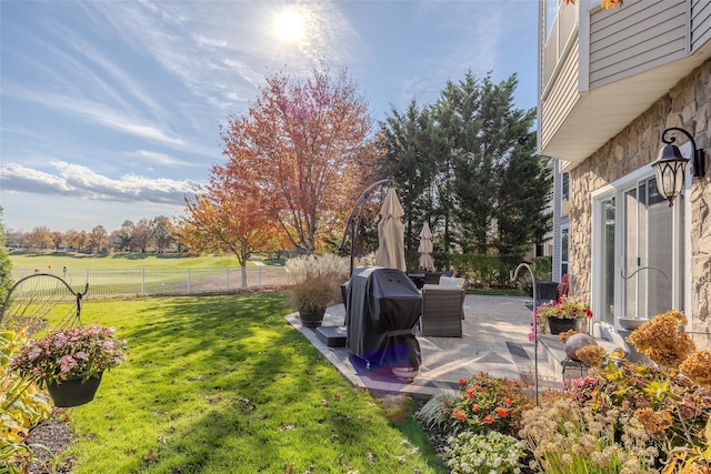 view of yard featuring a patio and fence