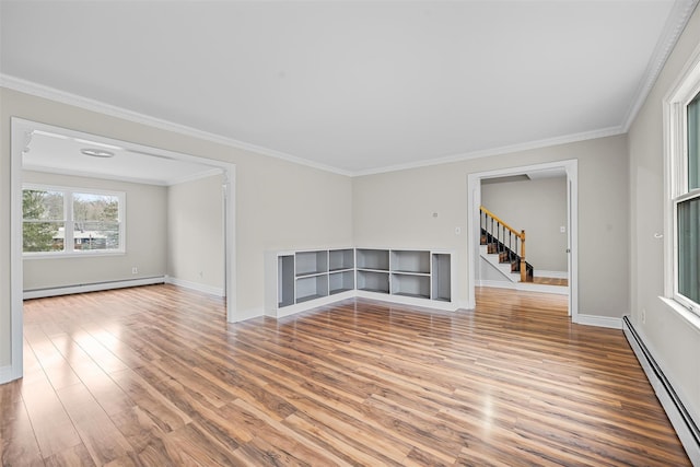 unfurnished living room featuring stairway, wood finished floors, a baseboard heating unit, crown molding, and baseboard heating