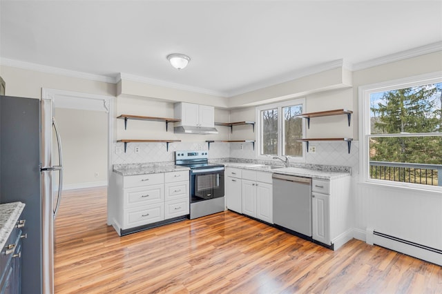 kitchen with ornamental molding, stainless steel appliances, a baseboard heating unit, and open shelves