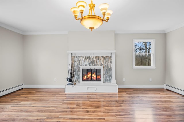 unfurnished living room with a baseboard heating unit, crown molding, a chandelier, wood finished floors, and a glass covered fireplace