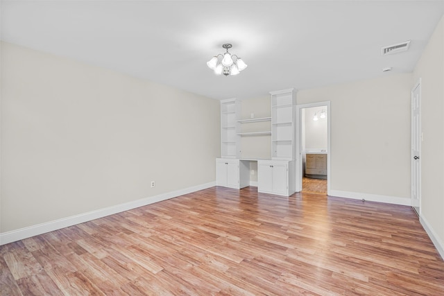 unfurnished living room featuring visible vents, baseboards, and light wood finished floors