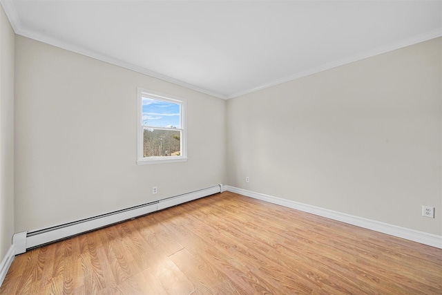 empty room with a baseboard heating unit, crown molding, and light wood finished floors