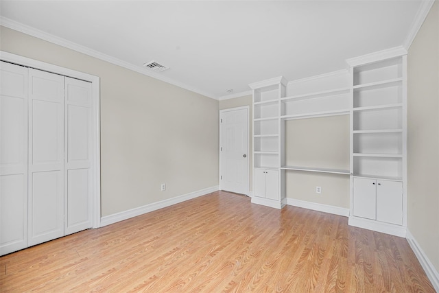 unfurnished bedroom featuring crown molding, baseboards, visible vents, and light wood-type flooring