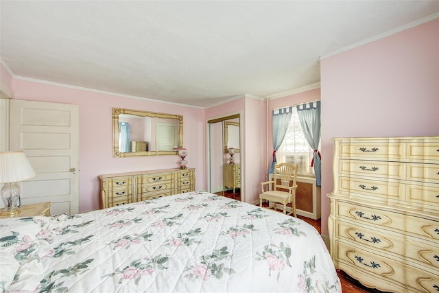 bedroom with crown molding and a closet