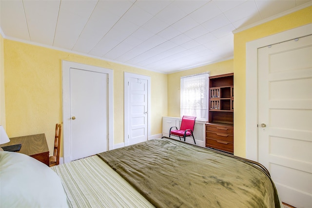 carpeted bedroom with crown molding