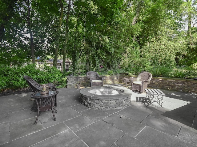 view of patio with an outdoor fire pit