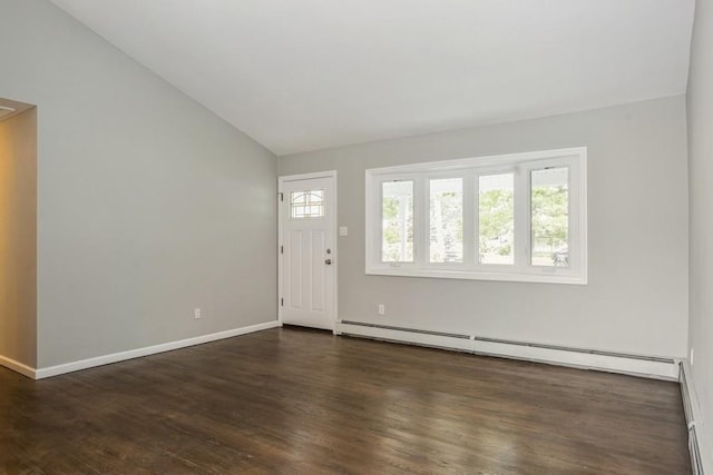 foyer with lofted ceiling, a baseboard radiator, wood finished floors, and baseboards