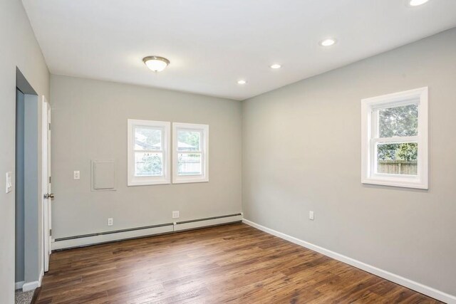 8 Fleet Rd, Shirley, NY 11967 - empty room featuring recessed lighting, baseboard heating, a wealth of natural light, and wood finished floors