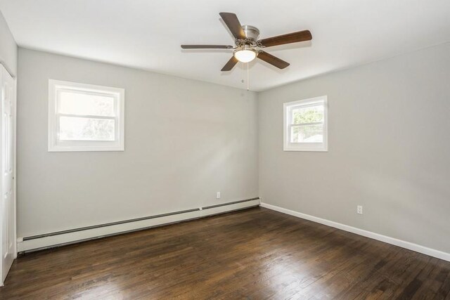 8 Fleet Rd, Shirley, NY 11967 - empty room with a ceiling fan, baseboards, a baseboard heating unit, and wood finished floors