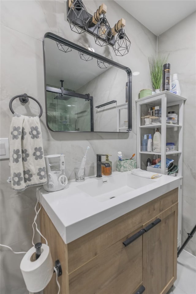 bathroom with tasteful backsplash, vanity, and tile walls