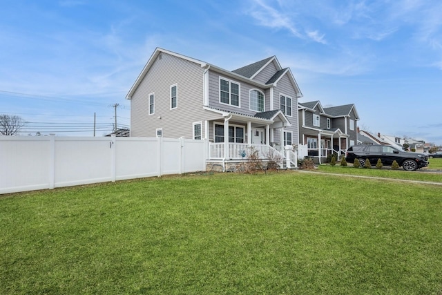 view of property exterior featuring a yard, a porch, and fence