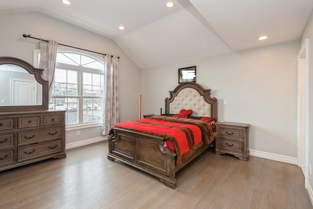 bedroom featuring vaulted ceiling, recessed lighting, light wood-type flooring, and baseboards