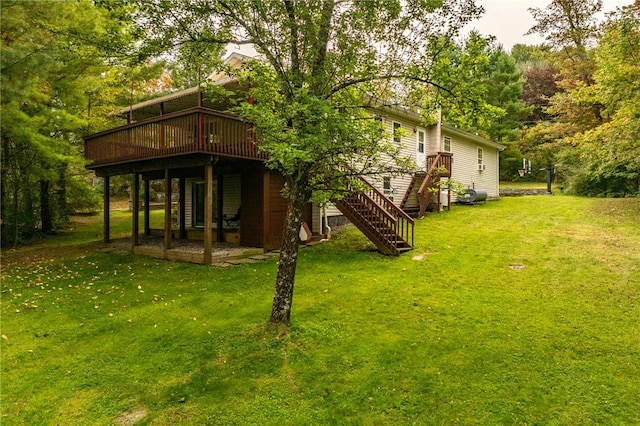 view of yard with stairway and a wooden deck