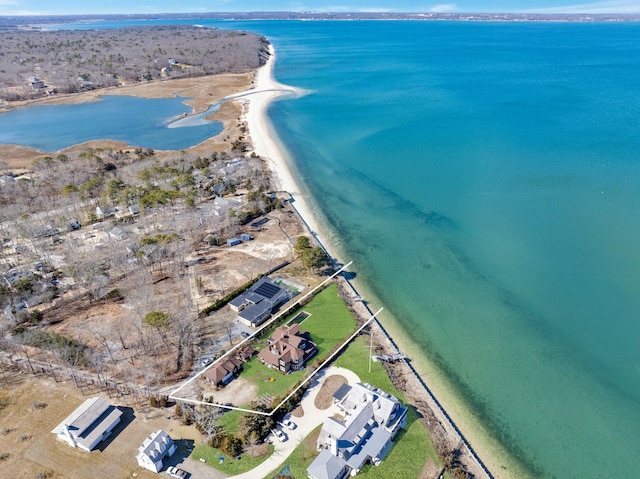 drone / aerial view featuring a view of the beach and a water view