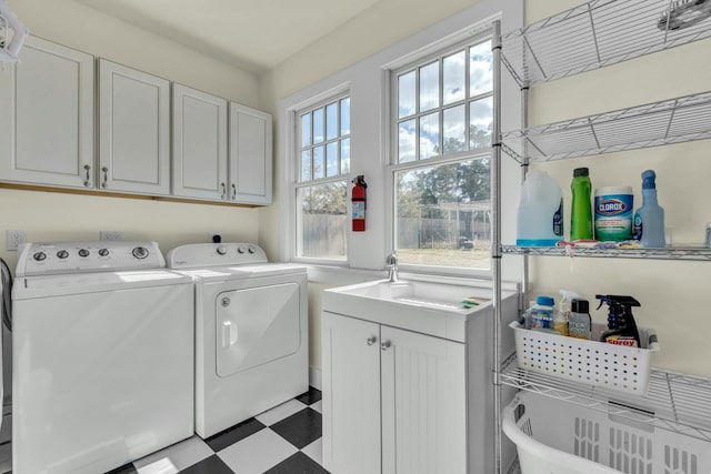 washroom featuring tile patterned floors, cabinet space, and independent washer and dryer