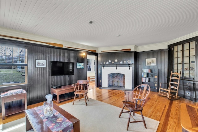 living area with wood finished floors and a fireplace