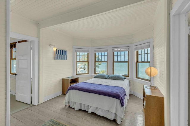 bedroom featuring light wood-style flooring and multiple windows