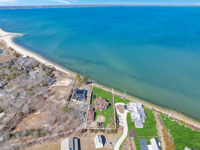 bird's eye view featuring a view of the beach and a water view