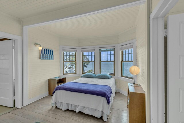 140 Newtown Rd, Hampton Bays, NY 11946 - bedroom featuring multiple windows and light wood-style flooring