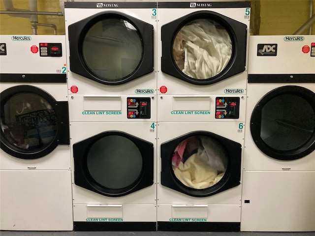 shared laundry area featuring stacked washing maching and dryer and separate washer and dryer