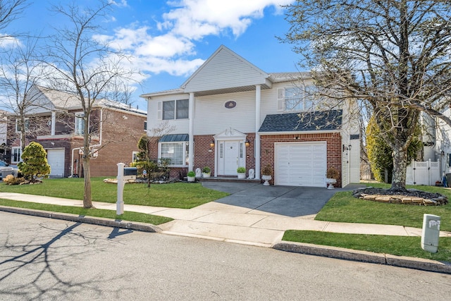 view of front facade with a shingled roof, brick siding, fence, driveway, and a front lawn