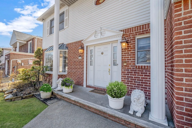 entrance to property with brick siding