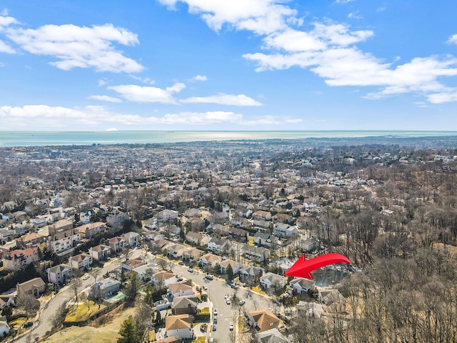 bird's eye view with a water view and a residential view