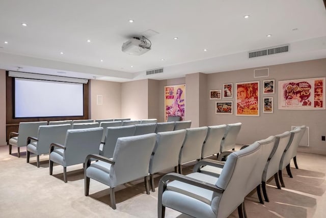 home theater room featuring recessed lighting, visible vents, and light carpet