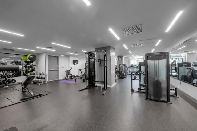 exercise room featuring baseboards and visible vents