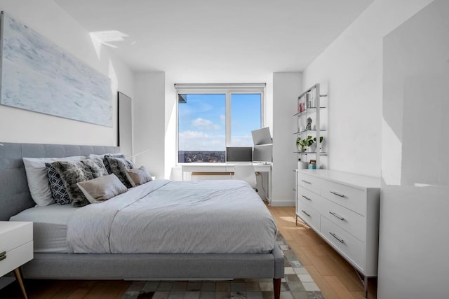 bedroom featuring light wood-style flooring