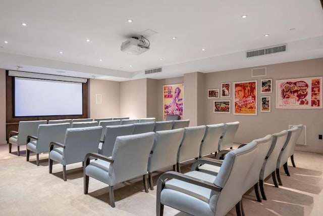 cinema with recessed lighting, visible vents, and light colored carpet