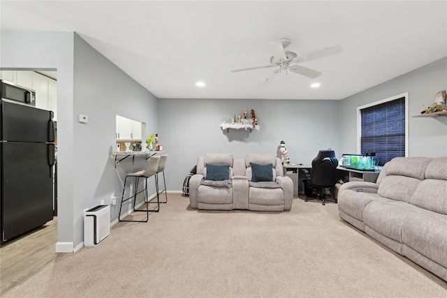 living area with baseboards, light colored carpet, a ceiling fan, and recessed lighting