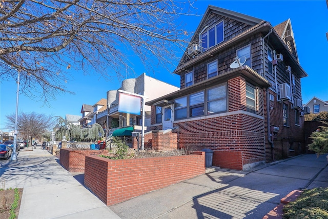 view of home's exterior with brick siding